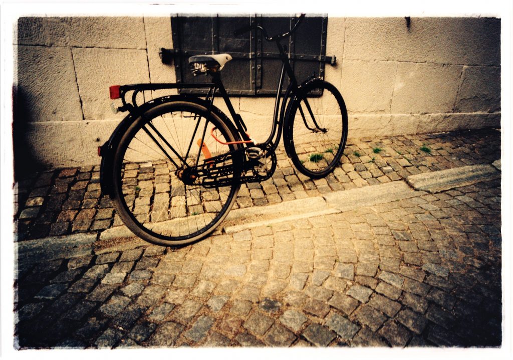 Color photo of Bike in urban surroundings