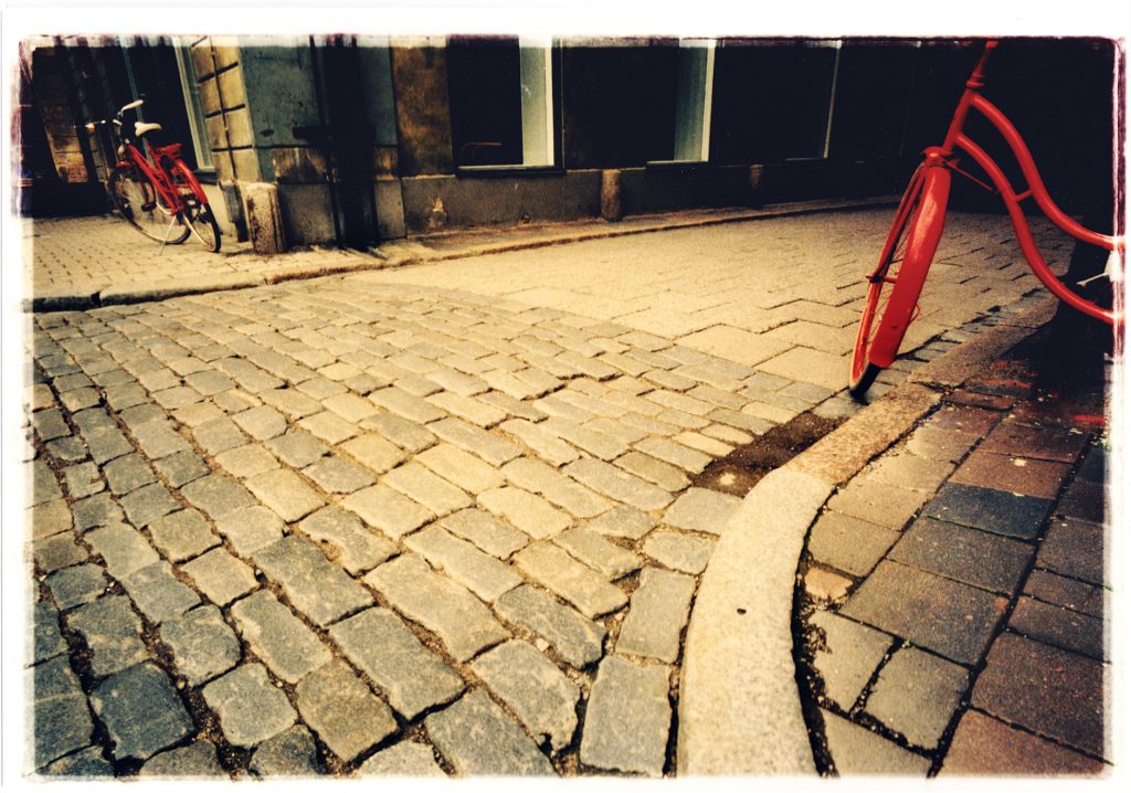 Color photo of Bike in urban surroundings