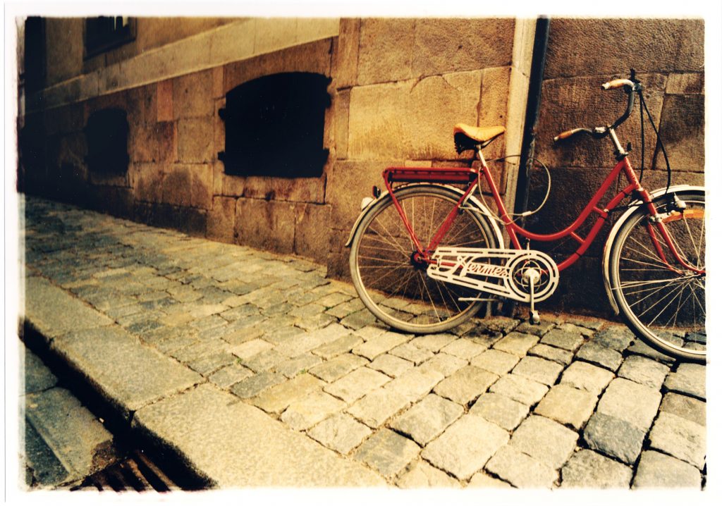 Color photo of Bike in urban surroundings