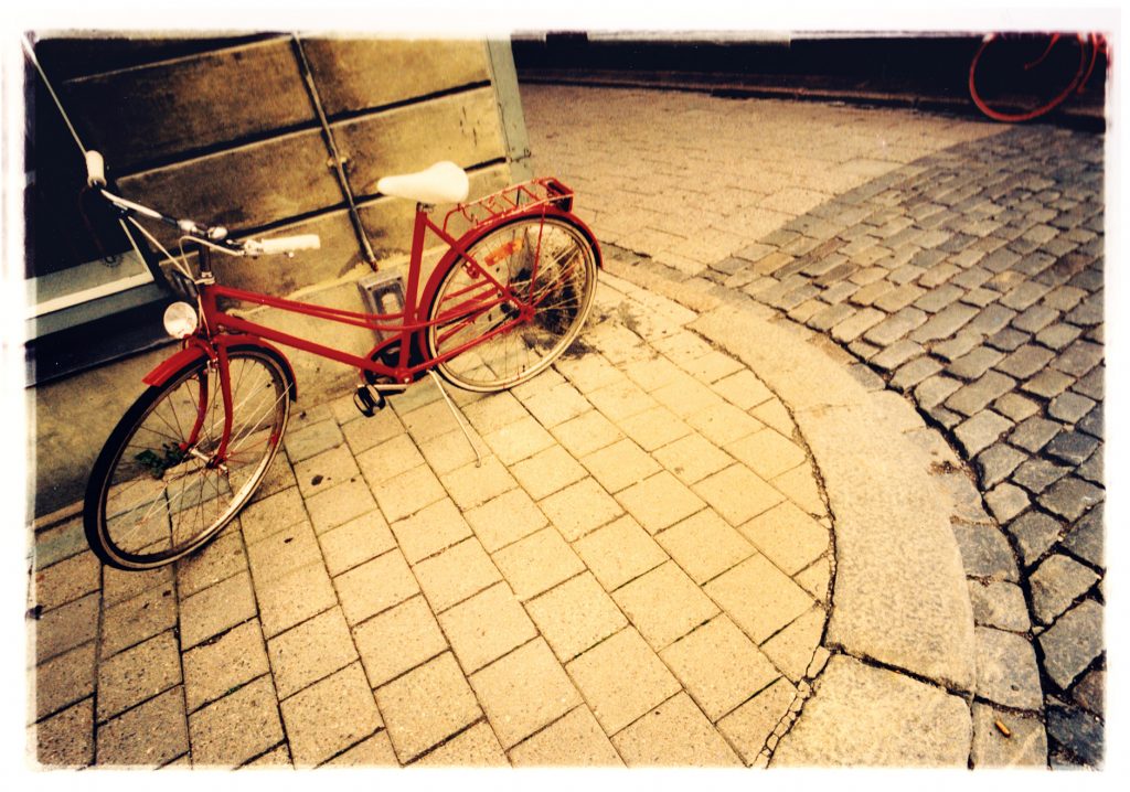 Color photo of Bike in urban surroundings