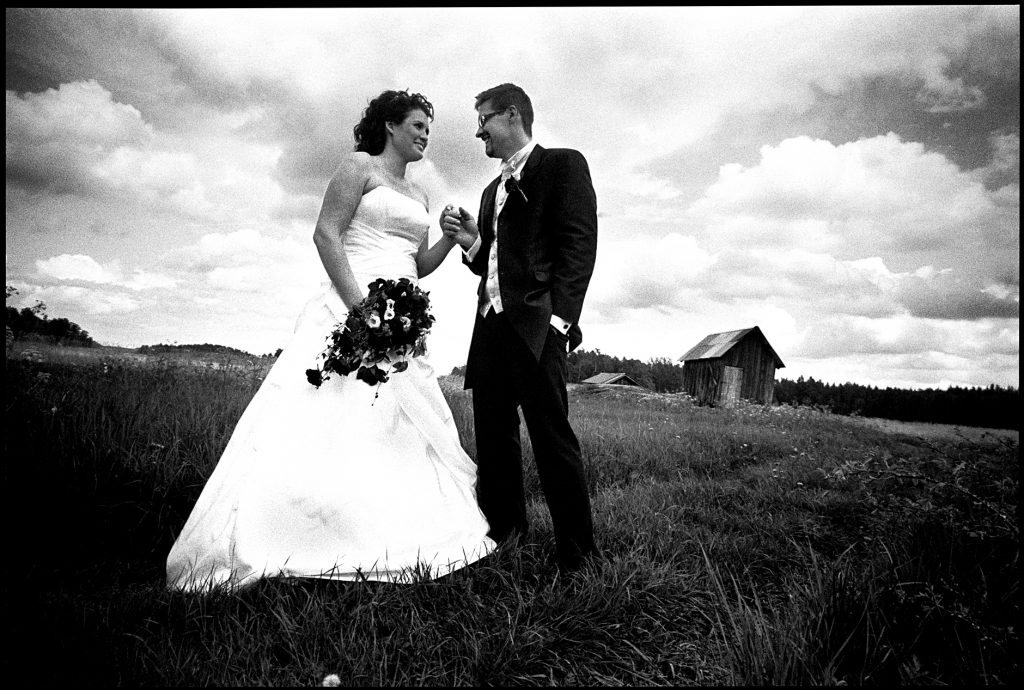 black and white wedding picture outside Wedding Sankt Anna, Sweden