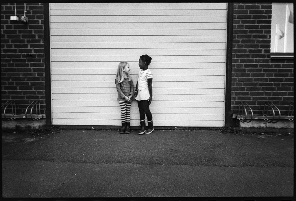 black and white image two girls playing