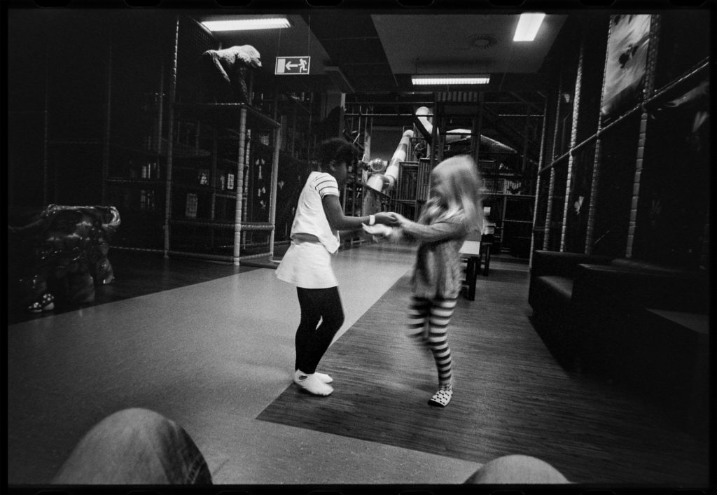 black and white image two girls playing